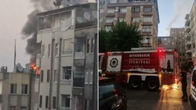 Diyarbakır'ın Yenişehir ilçesinde bir apartmanın çatı katında çıkan yangın, itfaiye