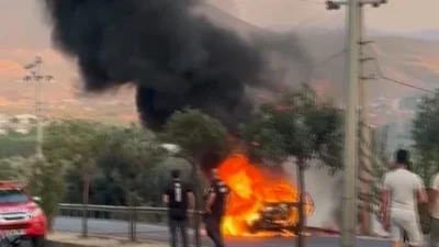 Milas'ta seyir halindeyken alev alan otomobil, itfaiye ekipleri tarafından kontrol