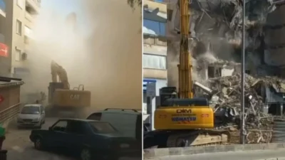 Kuşadası'nda kentsel dönüşüm kapsamında yıkılan beş katlı bina, yıkım anında